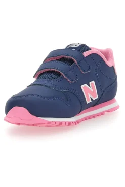 Blaue Sneakers New Balance 500 mit rosa Details und Klettverschluss